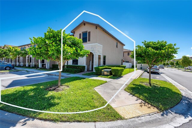 view of front facade with a front yard