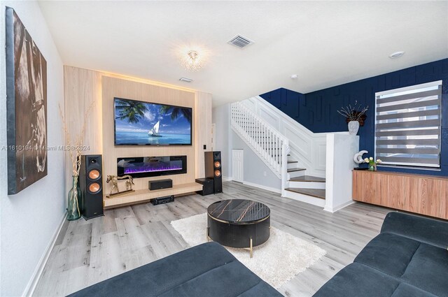 living room with light hardwood / wood-style flooring