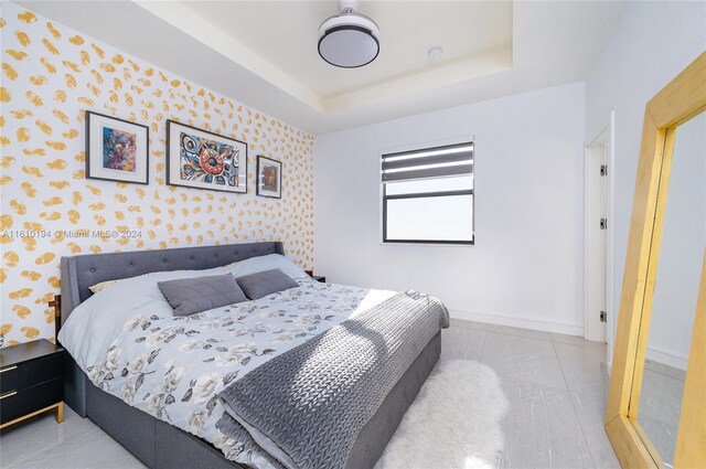 bedroom featuring a tray ceiling