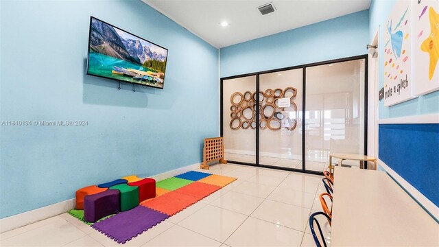 playroom with light tile patterned floors