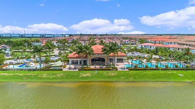 birds eye view of property featuring a water view