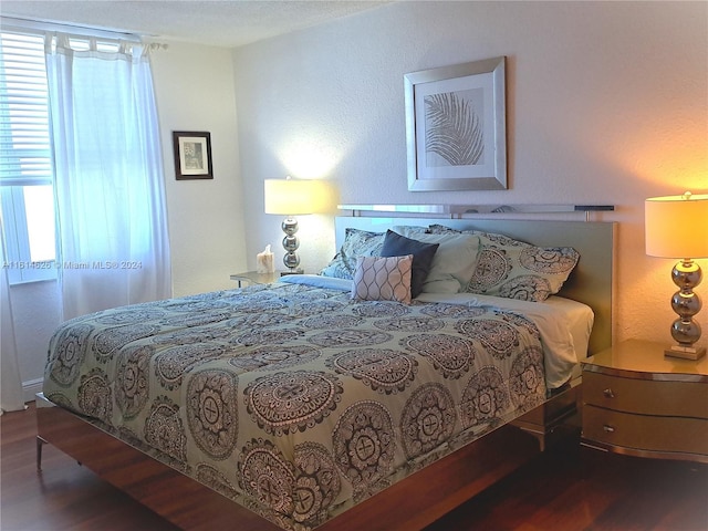 bedroom featuring dark hardwood / wood-style flooring