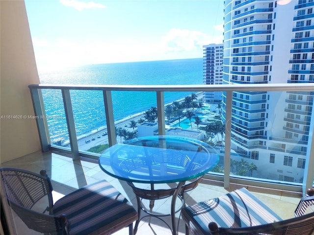 balcony featuring a water view