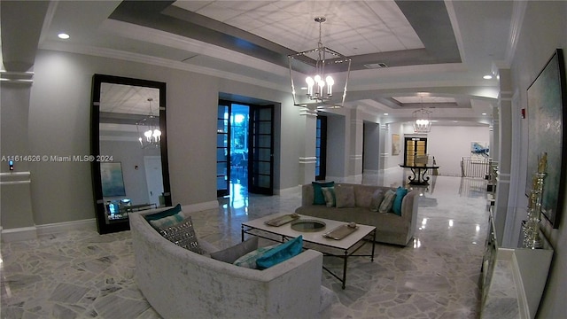 tiled living room with a notable chandelier and a raised ceiling