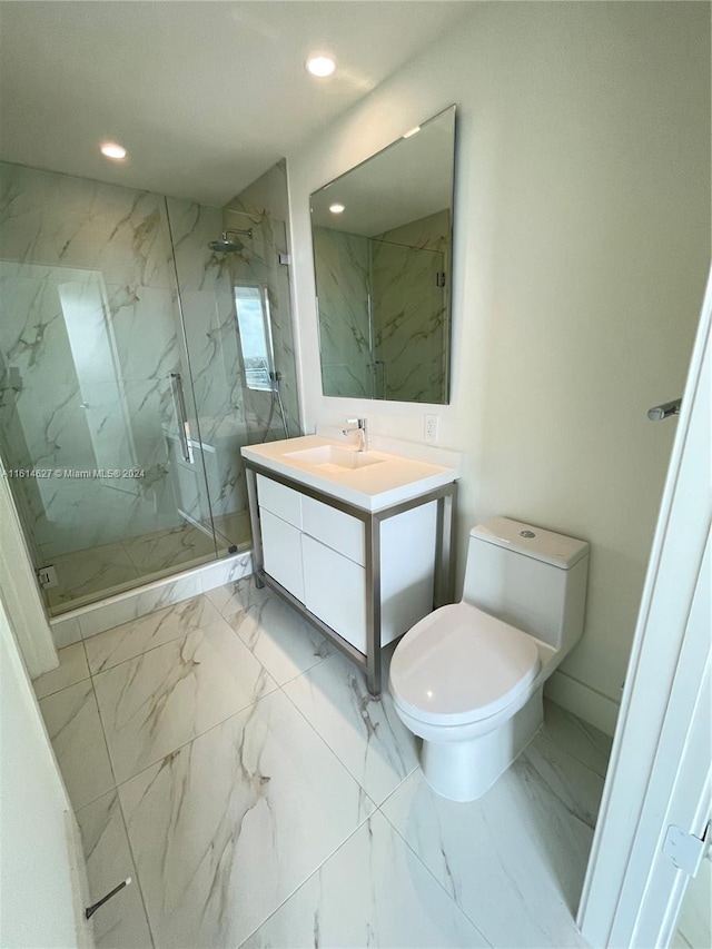 bathroom featuring large vanity, toilet, tile floors, and a shower with door