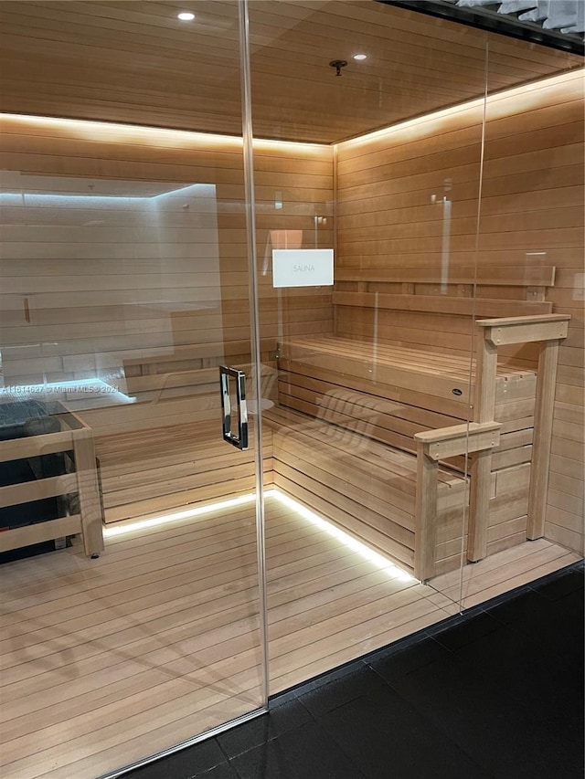 view of sauna / steam room featuring wood walls