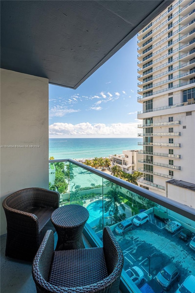 balcony featuring a water view