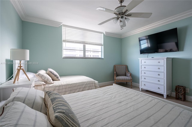 bedroom with hardwood / wood-style flooring, ceiling fan, and crown molding