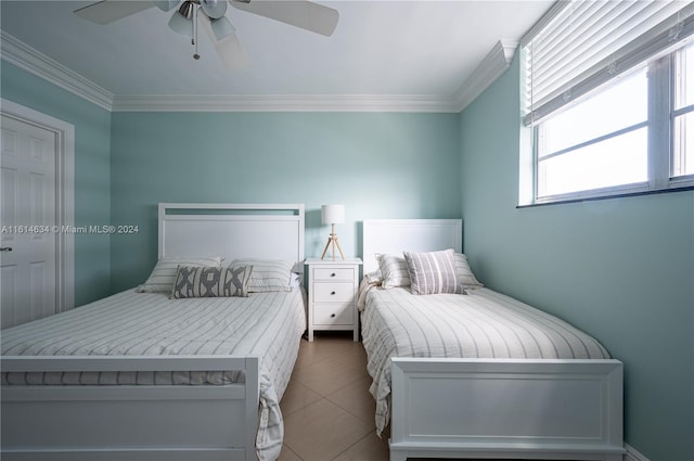 bedroom with tile patterned flooring, ceiling fan, and crown molding