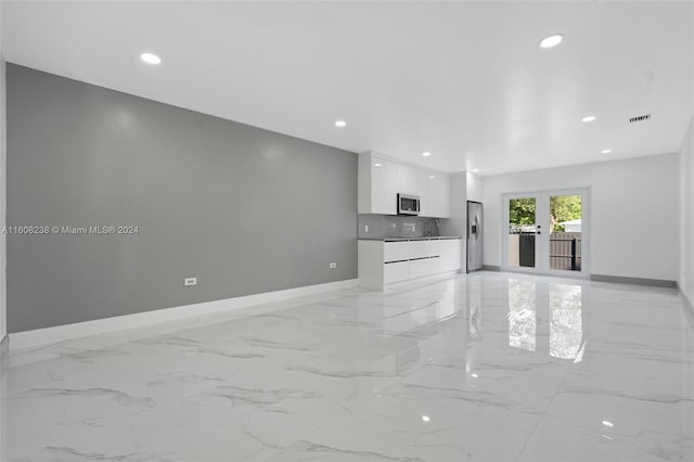 interior space with sink and light tile patterned floors