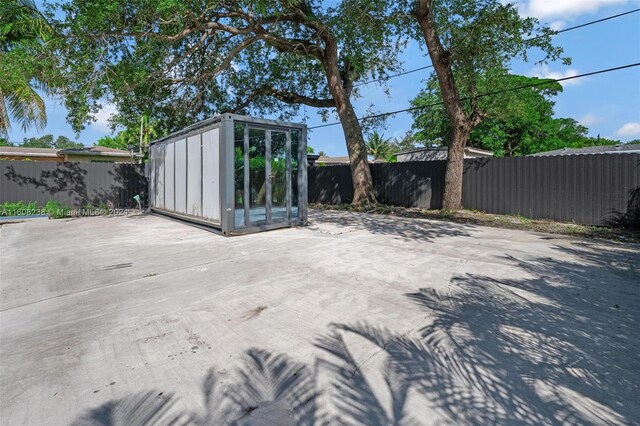 view of patio / terrace featuring a storage unit