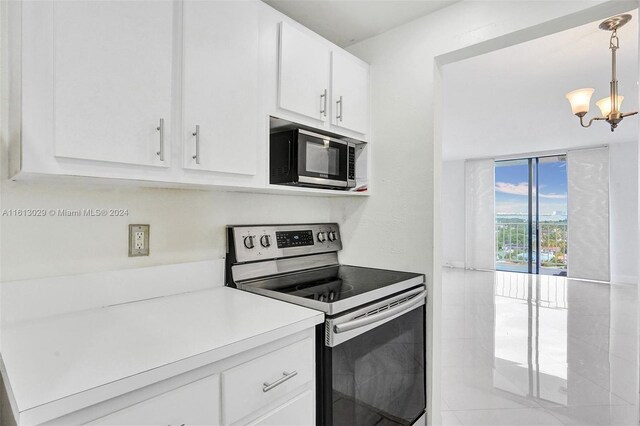 kitchen featuring white cabinetry, decorative light fixtures, stainless steel electric range, and a notable chandelier