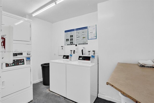 washroom featuring washer and dryer, stacked washing maching and dryer, and washer hookup