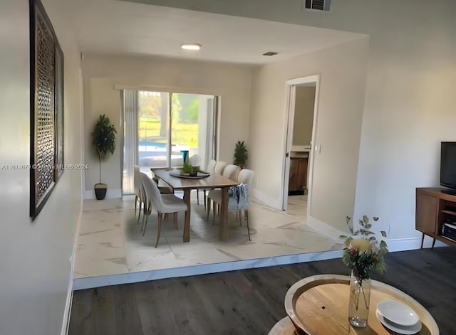 dining room with light hardwood / wood-style floors