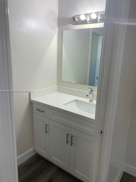 bathroom featuring vanity and wood-type flooring