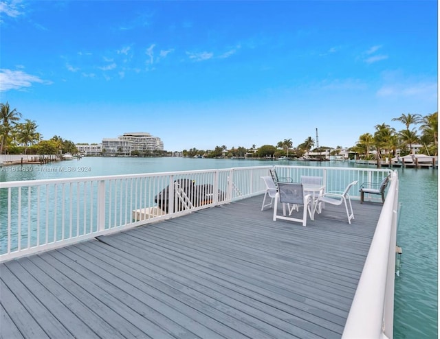 wooden deck with a water view