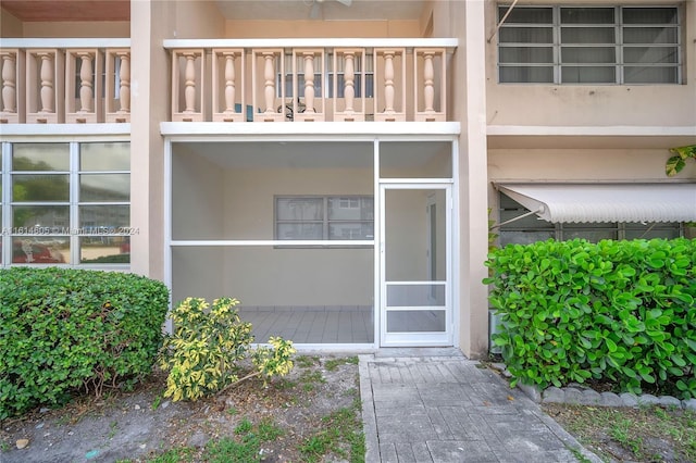 entrance to property with a balcony