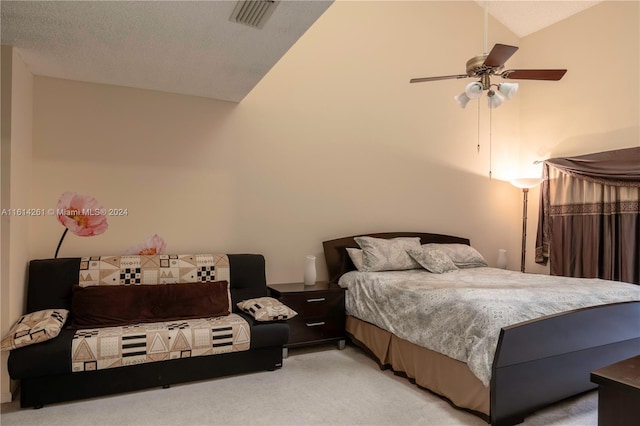 carpeted bedroom featuring a textured ceiling, ceiling fan, and lofted ceiling