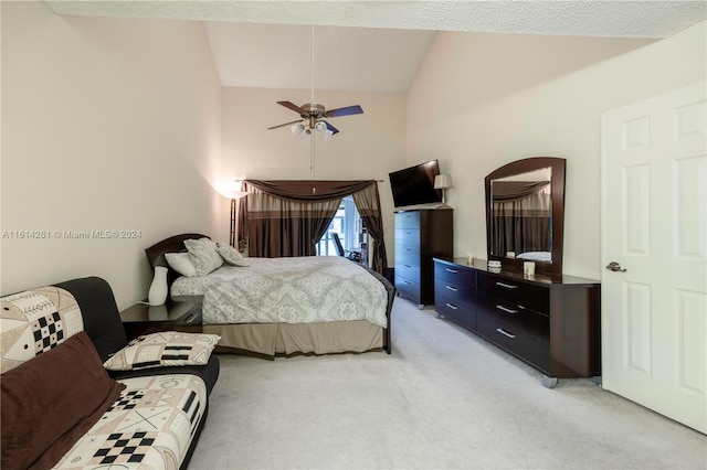 carpeted bedroom with high vaulted ceiling and ceiling fan