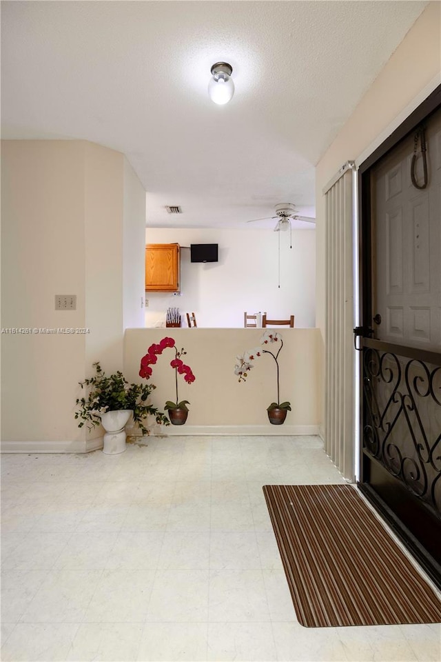 interior space with a textured ceiling