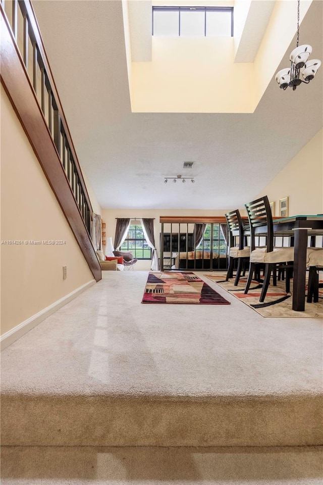 interior space with a chandelier and track lighting