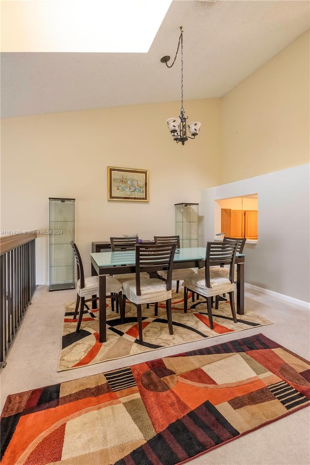 dining space with light carpet, lofted ceiling, and an inviting chandelier