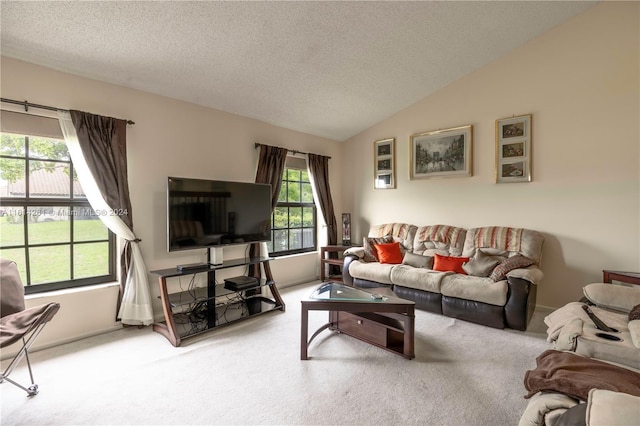 carpeted living room featuring a textured ceiling and lofted ceiling