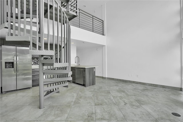 421 Meridian Ave Unit 16, Miami Beach, FL 33139 - kitchen with appliances with stainless steel finishes, light countertops, and baseboards