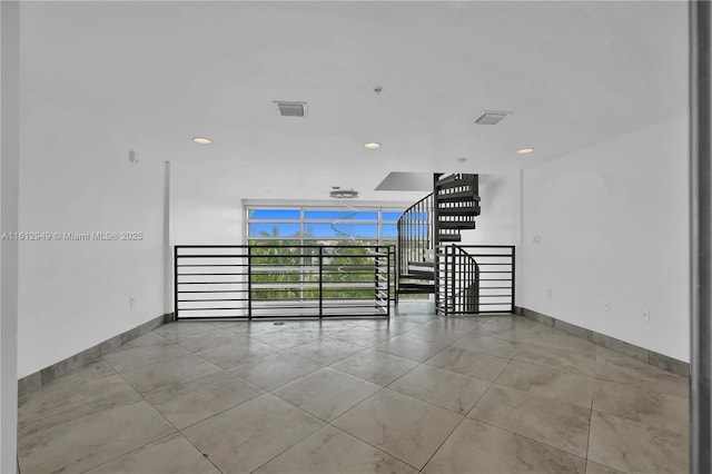 421 Meridian Ave Unit 16, Miami Beach, FL 33139 - unfurnished room with floor to ceiling windows, baseboards, recessed lighting, and tile patterned floors
