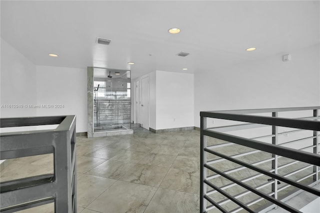 unfurnished dining area featuring light tile flooring