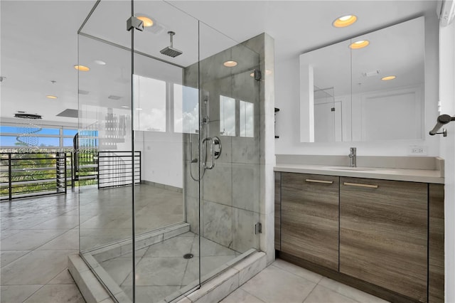 421 Meridian Ave Unit 16, Miami Beach, FL 33139 - bathroom featuring vanity, a stall shower, tile patterned floors, recessed lighting, and expansive windows