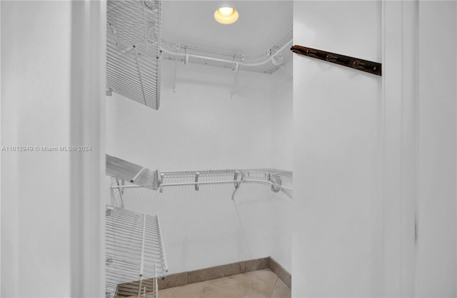 spacious closet featuring tile floors