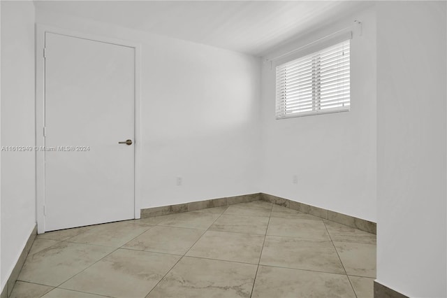 empty room with tile floors