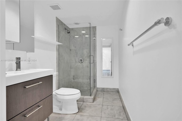 bathroom with tile floors, an enclosed shower, vanity, and toilet