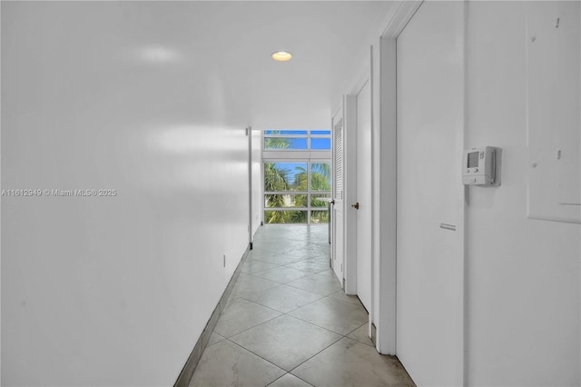 421 Meridian Ave Unit 16, Miami Beach, FL 33139 - corridor with baseboards, expansive windows, recessed lighting, and light tile patterned floors