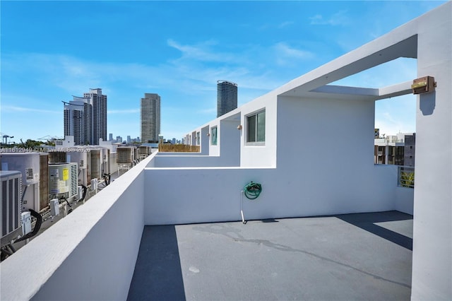 421 Meridian Ave Unit 16, Miami Beach, FL 33139 - view of patio with a balcony, a city view, and central AC unit
