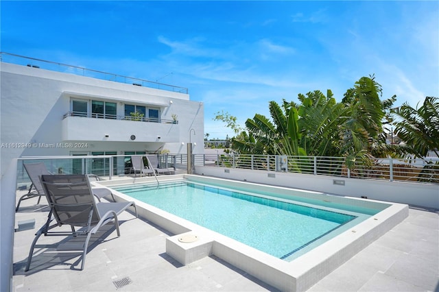 view of pool with a patio area