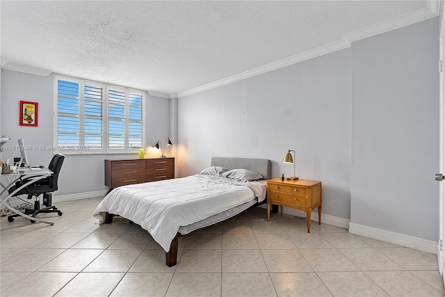 bedroom with light tile patterned flooring, ornamental molding, and a textured ceiling