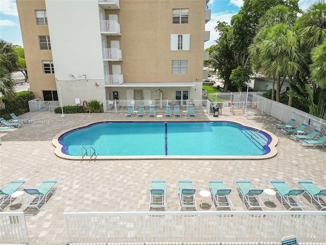 view of pool featuring a patio