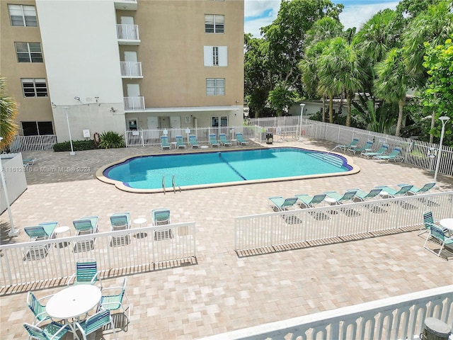 view of pool featuring a patio area