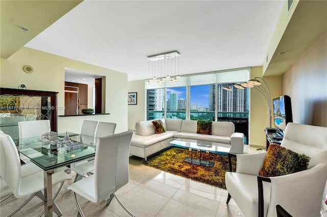 living room with light tile patterned floors, expansive windows, and a notable chandelier