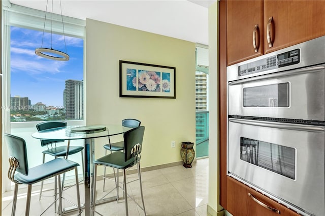 kitchen featuring light tile patterned floors and double oven