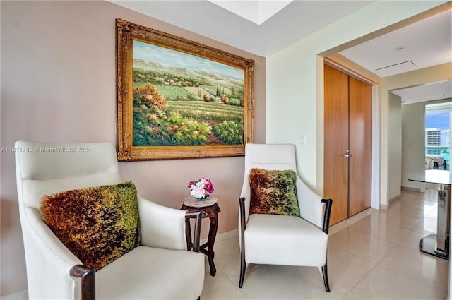 sitting room featuring light tile patterned floors