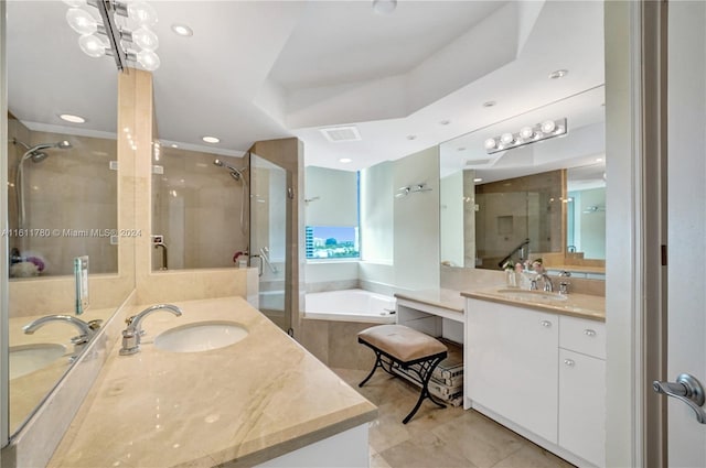 bathroom featuring tile patterned flooring, vanity, and independent shower and bath