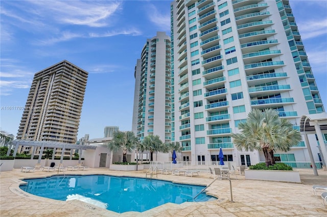 view of swimming pool with a pergola and a patio area