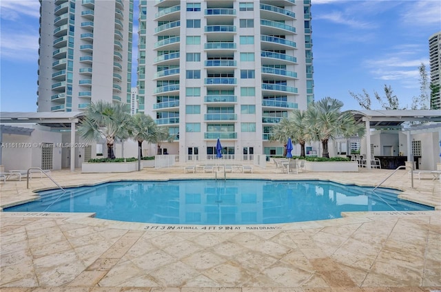 view of swimming pool featuring a patio area