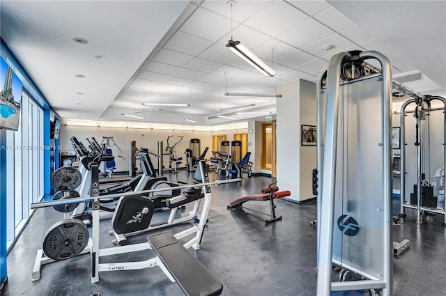 gym featuring a paneled ceiling