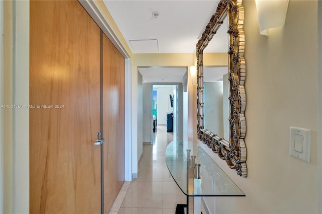 hall featuring light tile patterned floors