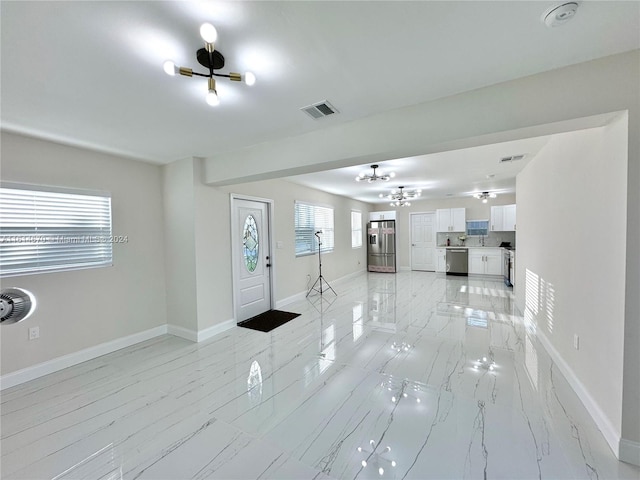 interior space featuring a chandelier