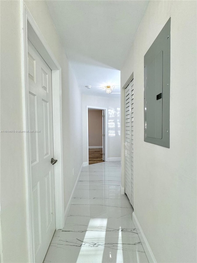 hallway featuring electric panel